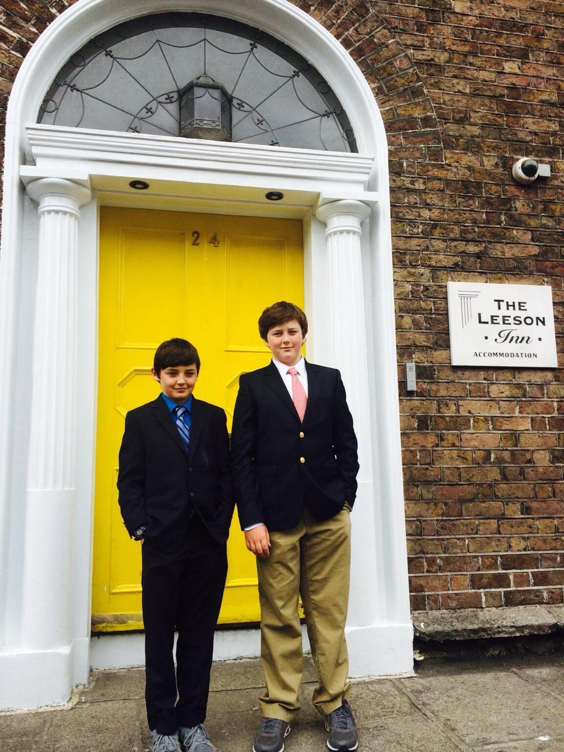 Two boys at a yellow Georgian doorway on Leeson Street, Dublin